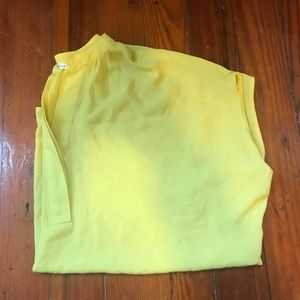Yellow short sleeve (almost cap sleeve) blouse.